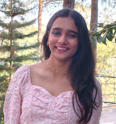Woman smiling with clear skin after following Careful Karma skincare tips
